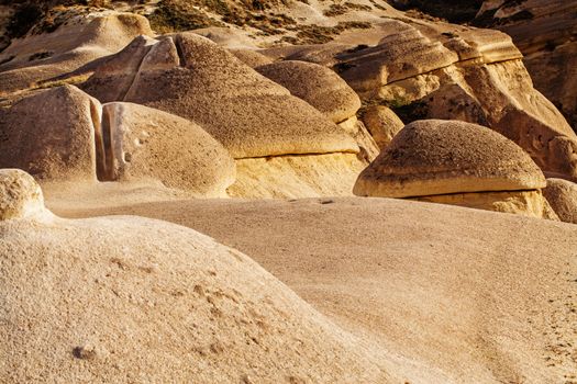 Cylindrical stone cliffs and cave houses near Goreme, Turkey