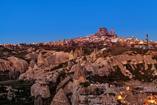 Cylindrical stone cliffs and cave houses in Goreme, Turkey