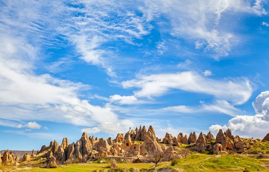 Cylindrical stone cliffs and cave houses near Goreme, Turkey