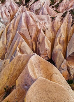 Beautiful stone cliffs in valley named Rose valley near Meskendir, Goreme, Turkey