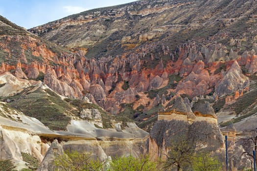 Beautiful stone cliffs in valley named Rose valley near Meskendir, Goreme, Turkey