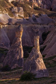 Cylindrical stone cliffs and cave houses near Goreme, Turkey