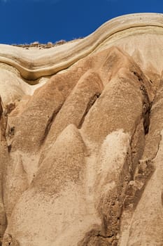 Beautiful stone cliffs in valley named Rose valley near Meskendir, Goreme, Turkey