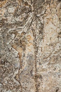 Texture of stone plate with inscriptions in ancient city Hierapolis