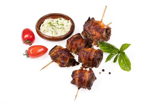 Meat and greenery on an isolated studio background