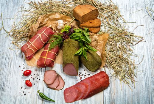 Sausages and vegetables on an old wooden desk