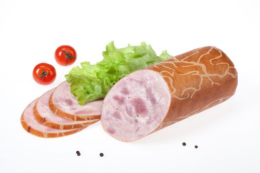 Isolated sausage with greenery on a white studio background
