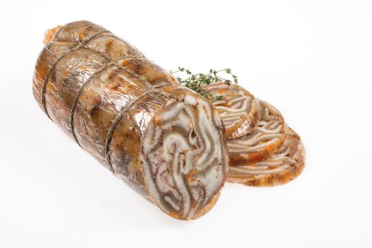 Sausage with greenery on an isolated studio background