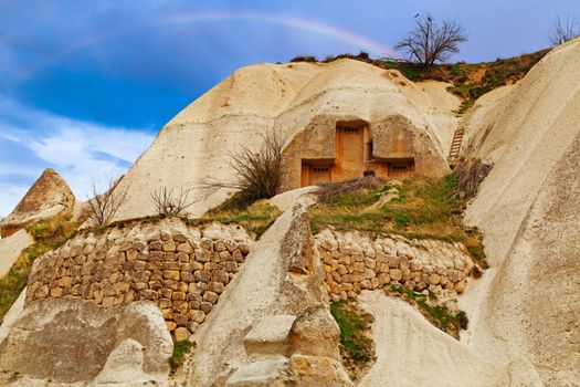 Cylindrical stone cliffs and cave houses near Goreme, Turkey