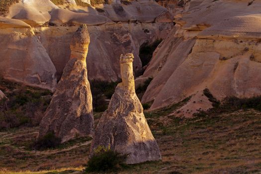 Cylindrical stone cliffs and cave houses near Goreme, Turkey