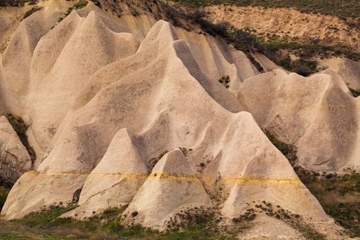 Beautiful stone cliffs in valley named Rose valley near Meskendir, Goreme, Turkey