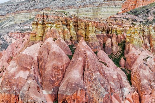 Beautiful stone cliffs in valley named Rose valley near Meskendir, Goreme, Turkey