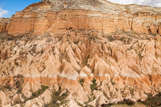 Beautiful stone cliffs in valley named Rose valley near Meskendir, Goreme, Turkey