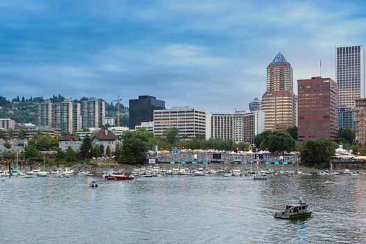 PORTLAND, OREGON - JULY 4, 2018: Portland Waterfront Blues Festival spectators along the Willamette River waterfront waiting for Indpendence Day fireworks show in downtown Portland Oregon.