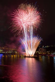 Fourth of July Independence Day fireworks display along Willamette River in downtown Portland Oregon waterfront