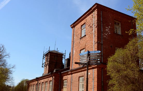 Red brick military building on Suomenlinna fortress island near Helsinki, Finland