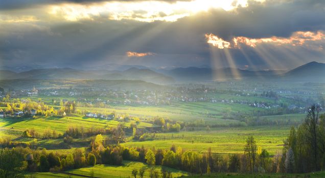 Rural landscape with sunbeams