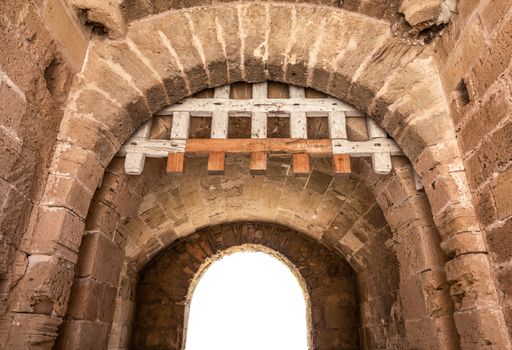 Isolated Ancient Medieval Fortress Archway With Wooden Portcullis