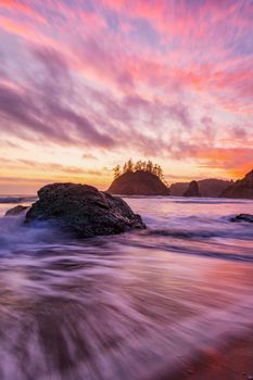 This is a color landscape photo of a vivid sunset over the Pacific Ocean.