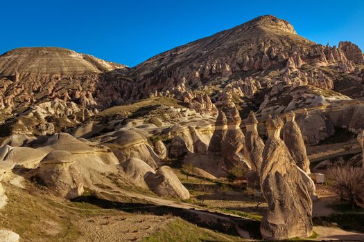 Beautiful stone cliffs in valley named Rose valley near Meskendir, Goreme, Turkey