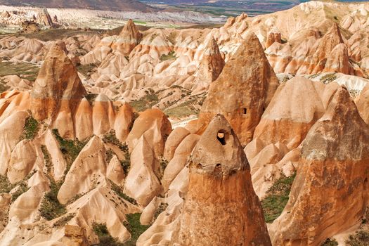 Beautiful stone cliffs in valley named Rose valley near Meskendir, Goreme, Turkey