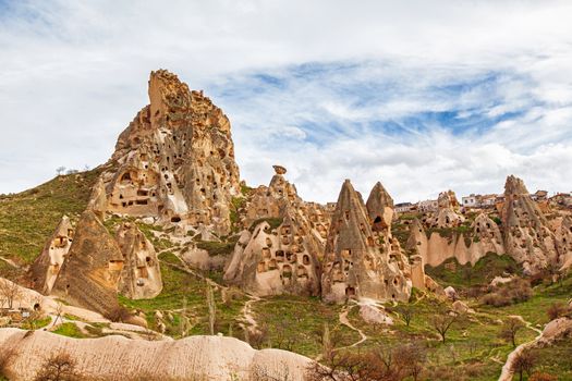 Stone cliffs and cave houses in Uchisar near Goreme, Turkey