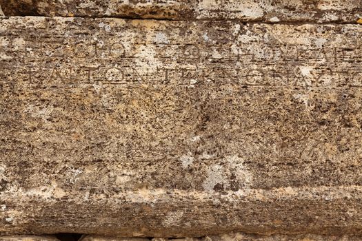 Texture of stone plate with inscriptions in ancient city Hierapolis