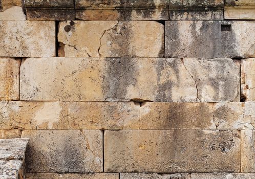 Texture of stone wall in ancient city Hierapolis, near Pamukkale, Turkey