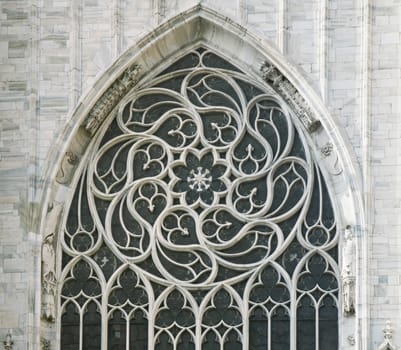 Ornamented window of a cathedral in gothic style