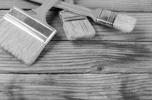 Brush for painting paint on wooden background