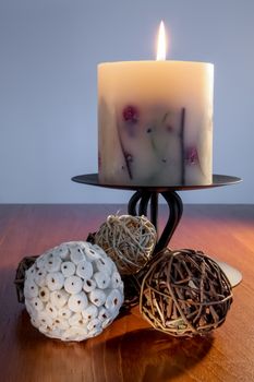 Decorative Candle alight on dining table