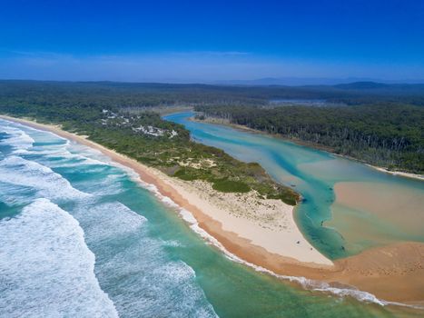 Durras lake inlet and the South Durras spit at Durras Beach on beautiful summer day