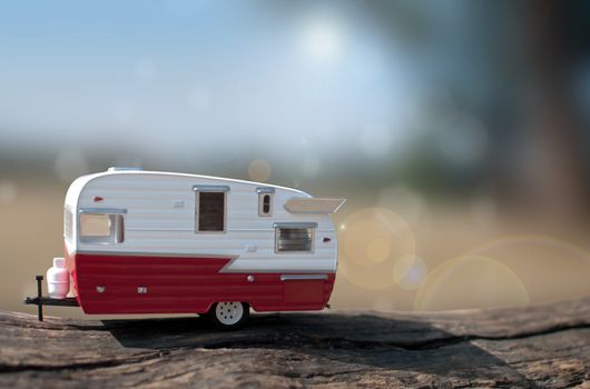 Miniature caravan trailer in the summer countryside