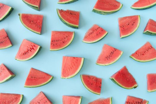Watermelon slices over a blue background