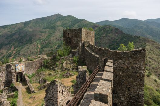 Maglic, Serbia - May 5, 2018: On the wall of medieval fortress Maglic, mountain range at background , Serbia
