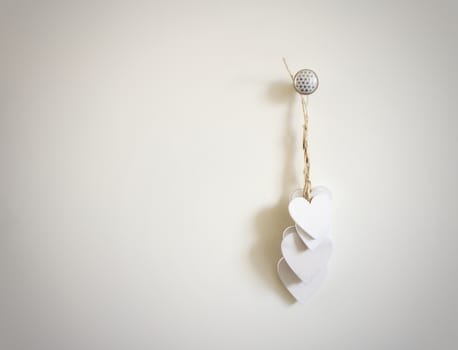 Group of white wooden hearts hanging