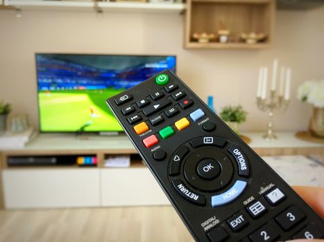 Watching the soccer world cup on television switching with the remote control