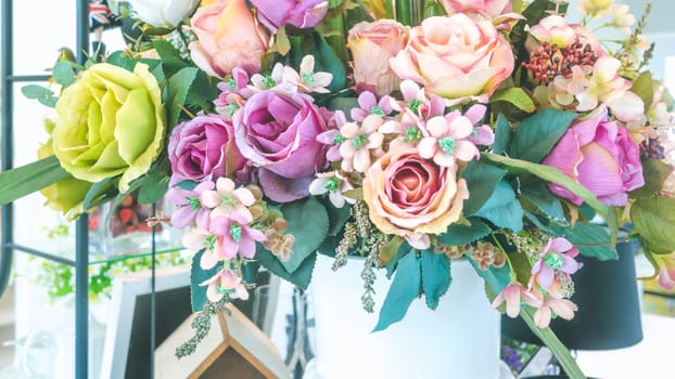 colorful of the plastic flowers bouquet , soft of focus