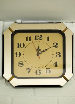 COLOR PHOTO OF ANTIQUE CLOCK MOUNTED ON WALL