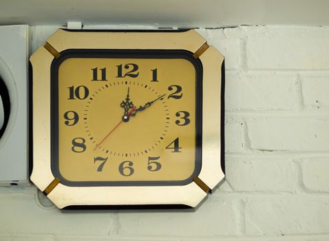 COLOR PHOTO OF ANTIQUE CLOCK MOUNTED ON WALL