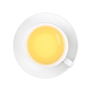 Close up one full white cup of green oolong tea on saucer isolated on white background, elevated top view, directly above