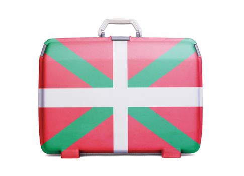 Used plastic suitcase with stains and scratches, printed with flag - Basque Country