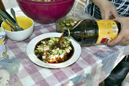 adding kvass to okroshka, Russian cold vegetable soup