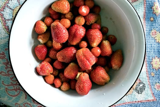 plate with red ripe Victoria top view