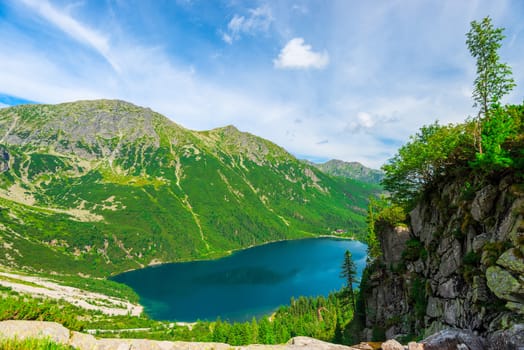 view from the altitude to the lake Morskie Oko in the Tatra mountains on a summer sunny day