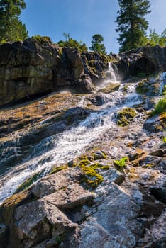 mountain fast stream, landscape on a sunny day, close-up stones