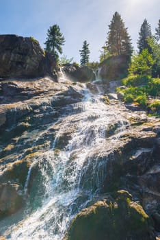 beautiful and fast stream, landscape on a sunny day, close-up stones