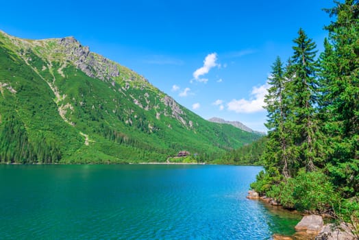 a picturesque clean mountain lake in the Tatras, a landmark of Poland - Morskie Oko