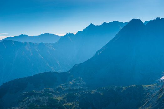 high beautiful mountains of the Tatra in the haze on a sunny day, landscape