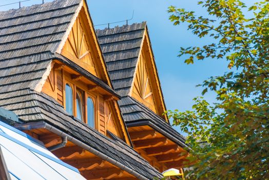 roof of a two-story house against the blue sky